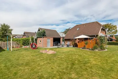 Image de Maison de vacances 'Friesenkate Frieko' avec terrasse, jardin privé et Wi-Fi