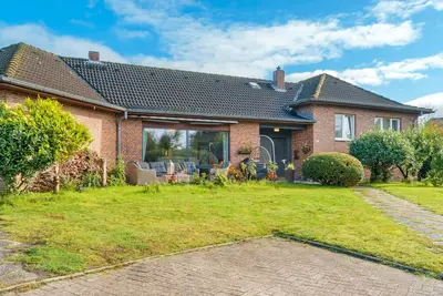 Image de Maison de vacances 'Küstenglück' avec terrasse privée, jardin commun et Wi-Fi