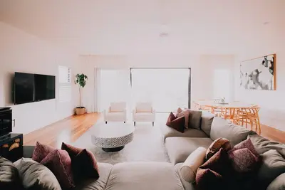 Image de Woodleigh Estate - Step into a world of timeless elegance and unparalleled charm at Woodleigh Estate. This historic 1860's home is nestled on a one acre estate landscaped with cottage like gardens. From the moment you enter the home you are envelope