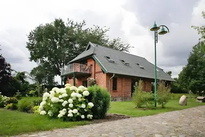 Image de Maison de vacances 'Seeadler Am Dümmer' avec vue sur le lac, terrasse privée et Wi-Fi