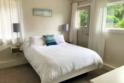 Sun drenched, beach inspired, guest suite.