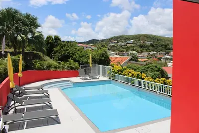 Image de Le Cocon des Antilles Appart Noix De Coco bas de villa avec piscine partagée