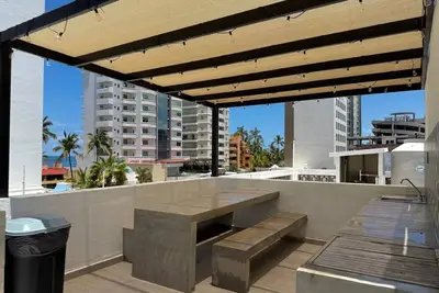 Image de Loft a few steps from the beach By PartnerHostRentas