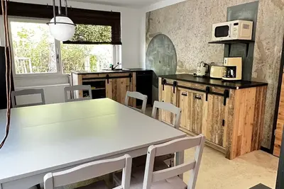 Image de Carotel Industrial Style meets Waldesruhe with a dog