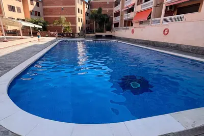 Image de Appartement 'Cap Salou-Urb Oromar' avec vue mer, piscine et climatisation
