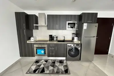 Image de Cozy 2-bedroom Apartment with WiFi and fitness room in charming Accra
