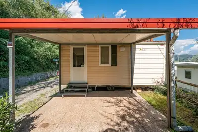 Image de Mobil-home 'Camping Belsito Olib 504' avec piscine partagée, Wi-Fi et climatisation