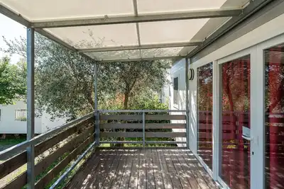 Image de Mobil-home 'Camping Belsito Venere 509' avec piscine commune, Wi-Fi et climatisation