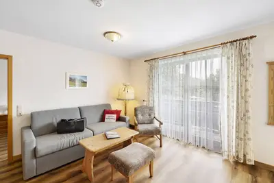 Image de Appartement 'Fewo Brünnstein - N° 44 Piscine, Sauna' avec vue sur la montagne, jardin commun et Wi-Fi