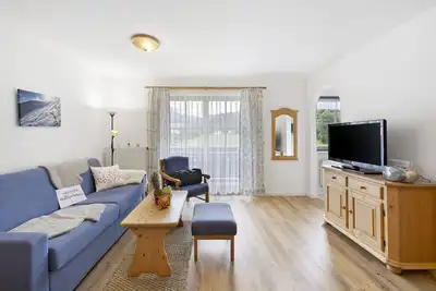 Image de Appartement de vacances 'Fewo Brünnstein Romantikwohnung - N° 35 Piscine, Sauna' avec vue sur la montagne et Wi-Fi