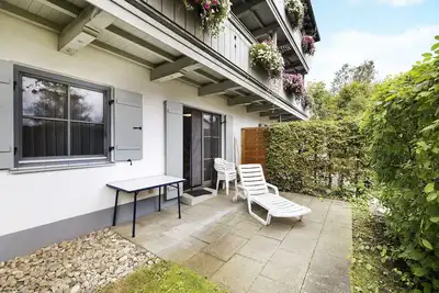 Image de Appartement 'Fewo Brünnstein - N°2, piscine, sauna' avec vue sur la montagne, terrasse privée et Wi-Fi