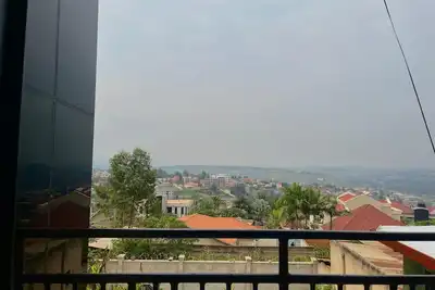 Image de 5 minute ride to the Kigali Genocide Memorial. Double room with balcony