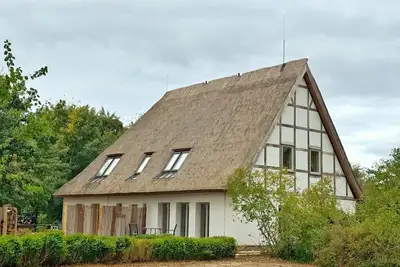 Image de Rural idyll in a thatched-roof house with sauna