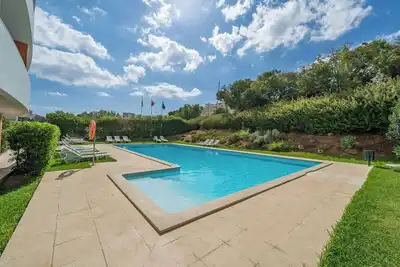 Sunlit Poolside Retreat w/ Balcony by HostWise