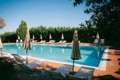 Image de Appartement '79 B Fattoria Degli Usignoli' avec piscine partagée, Wi-Fi et climatisation