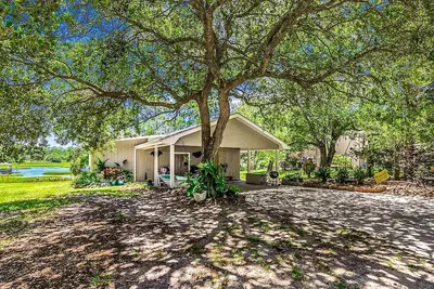 Unique riverfront home with two suites, high-speed WiFi, & private dock