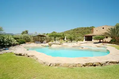 Image de Tennis Court. Heated indoor pool. Jacuzzi. Unique stunning beautifully designed free-form pool. Stylish Mallorca Villa, nice fittings, furnishings and decor throughout.