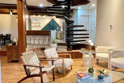 Image de Wood-beam ceilings, large glass windows & a stunning spiral staircase suspended