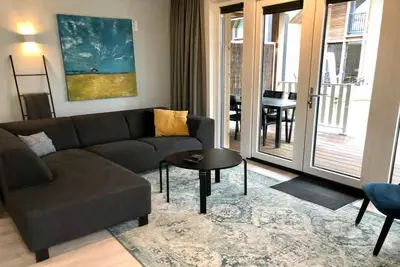 Image de Lodge spacieux avec véranda à Zoutelande