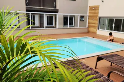 Image de Apartment in the heart of Bombinhas (ground floor) with a swimming pool in the condominium.