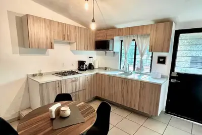 Image de House with terrace in front of park, next to the Center