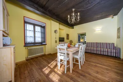 Image de A cozy 65 square meters apartment, perfect for eight people, located on the first floor of a historic building built in 1864 and renovated in 2025 while maintaining its historic atmosphere (No elevator). The property is located on Tarvisio's main street,