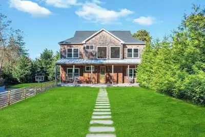 Image de Southampton sanctuary with resort-style pool, lush grounds, and spacious. . .