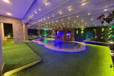 Image de Luxury 7-Bedroom Smart House with Resort-Style Heated Pool + Waterfall + Garden