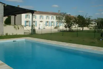 Image de Maison de vacances « La Longère Suzanne » avec piscine partagée, terrasse et Wi-Fi