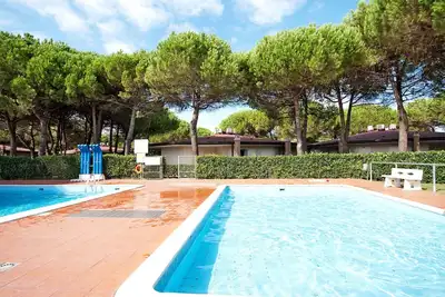 Image de Joli appartement avec climatisation, piscine, Wifi, Tv, terrasse et animaux admis