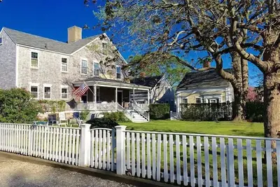 Antique home with large front lawn