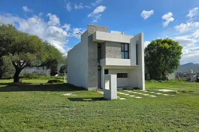 Image de Casa Olivo with double height living room, surrounded by a large garden.