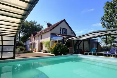 Image de Maison de vacances « Le Clos Fleuri » avec vue sur la montagne, Wi-Fi et climatisation