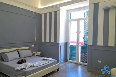 Image de Chambre d’hôtes « Appartamento - Orchidea Celeste » avec vue mer, Wi-Fi et climatisation