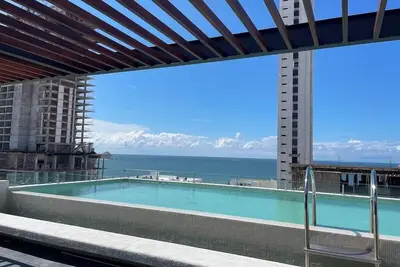 Image de Stylish Brand New Family-sized Condo Steps to Beach & Malecón