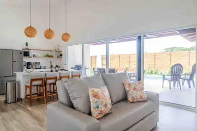 Image de Peaceful coastal home with private pool, outdoor patio & tropical garden views