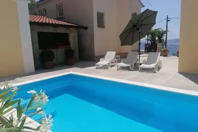 Image de Gesamte Wohnung mit Terrasse und Meerblick by Interhome