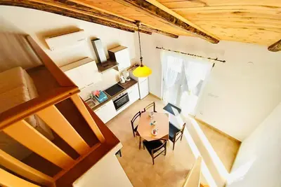 Image de Dachgeschosswohnung auf zwei Etagen mit schönem Meerblick by Interhome