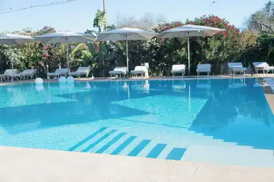 Image de Boomerang Home 1 – Suite nel Boomerang Village Resort 4 Stelle – a soli 5 minuti da Punta Prosciutto