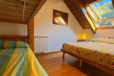Image de Dachgeschosswohnung mit Velux erta 3 Vall de Boí by Interhome