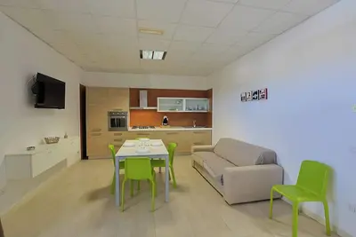 Image de Boomerang Home 2 – Suite nel Boomerang Village Resort 4 Stelle – a soli 5 minuti da Punta Prosciutto