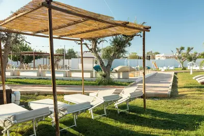 Image de Boomerang Home 3 – Suite nel Boomerang Village Resort 4 Stelle – a soli 5 min dalla Salina dei Monaci