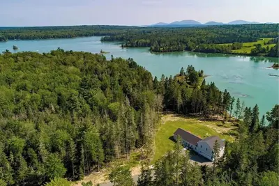 Image de Oceanfront, modern + mobility-minded home with hot tub, fire pit and game room