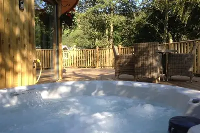 Image de The Crannog | Circular Riverside Retreat with Hot Tub