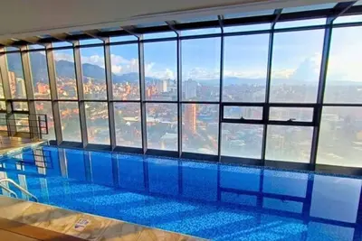 Image de Oasis in Zona T with 2 Queen Beds, Pool, Sauna & Gym