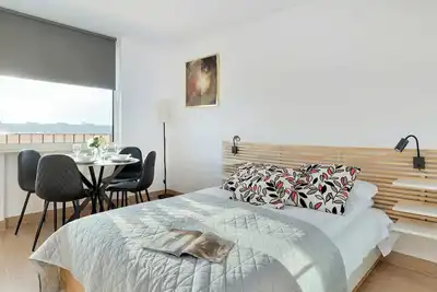 Image de Piastowska 100c Gdańsk | Beige and Grey Studio with Balcony