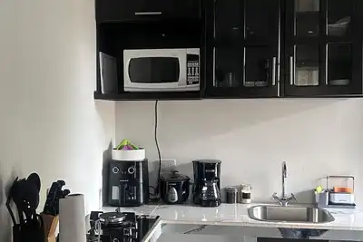 Image de Nuestro apartamento es fabuloso porque tiene aire acondicionado y un jacuzzia