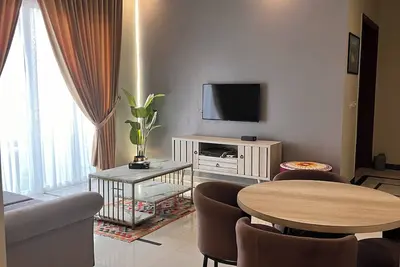 Cozy 2-bedroom condo in secured compound.