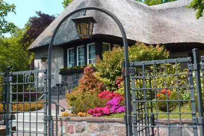 Image de Rügen vacation near the beach - Landhaus Wilkens vacation apartment Reetblick