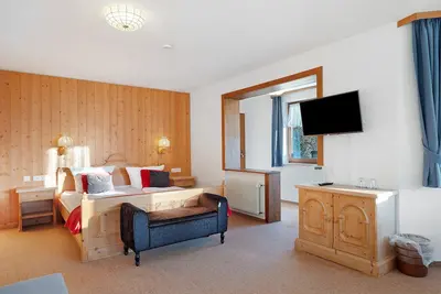 Image de Appartement 'Familienzimmer Deluxe 11' avec vue montagne, terrasse privée et Wi-Fi